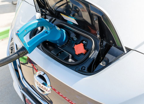 Electric car plugged for charging