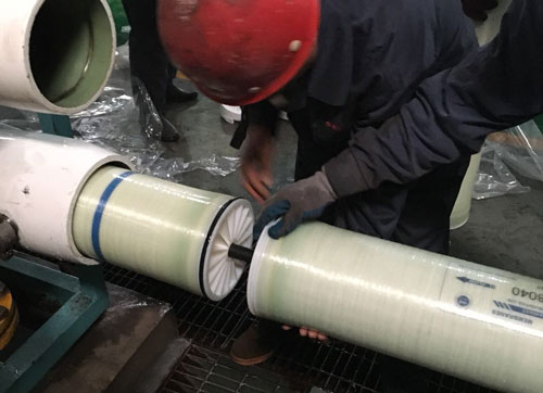 Engineer installing a filtration membrane for Sulfate or sulphate removal